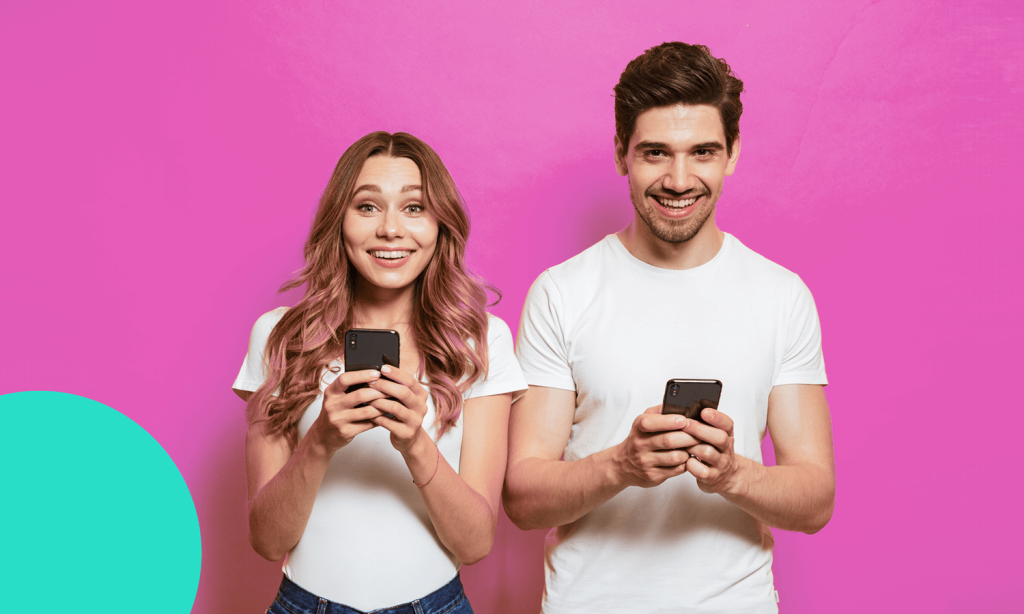 lady and guy holding phones and smiling.