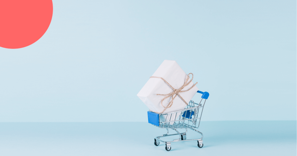 shopping cart with a present in it.